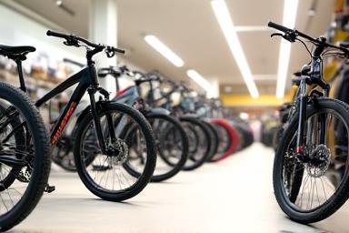 Image showing a diverse range of bicycles displayed in a modern bike shop, representing options and advice for purchasing.