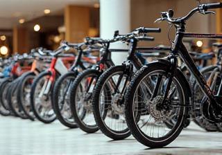 Image showing a selection of sleek, modern city bikes lined up, highlighting variety and style for urban commuters.